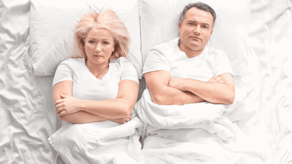Divorcing couple laid in bed